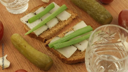 Presentation of national Ukrainian snack and alcoholic beverage - vodka, horilka photo