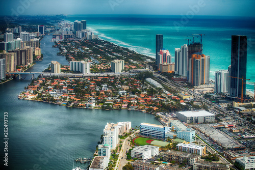 MIAMI BEACH - MARCH 29  2018  Aerial view of Miami Beach skyline with buildings. The city attracts 20 million people annually
