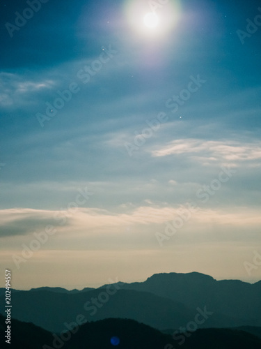 summer travel and landscape concept from night and moon light on mountain with star and sky background