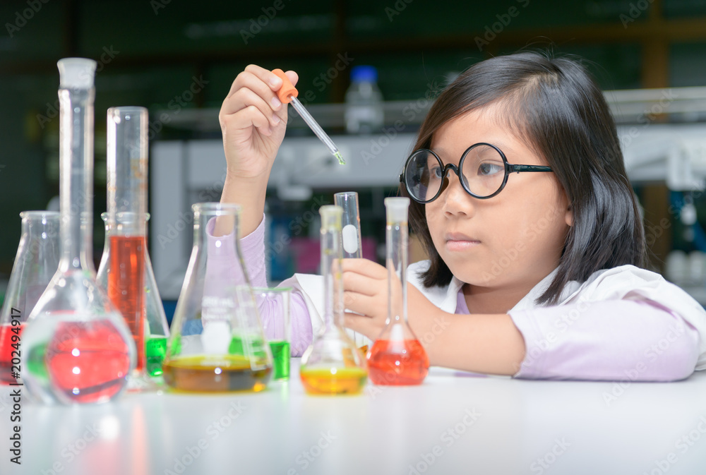 Little scientist making experiment with test tube Little scientist making experiment with test tube