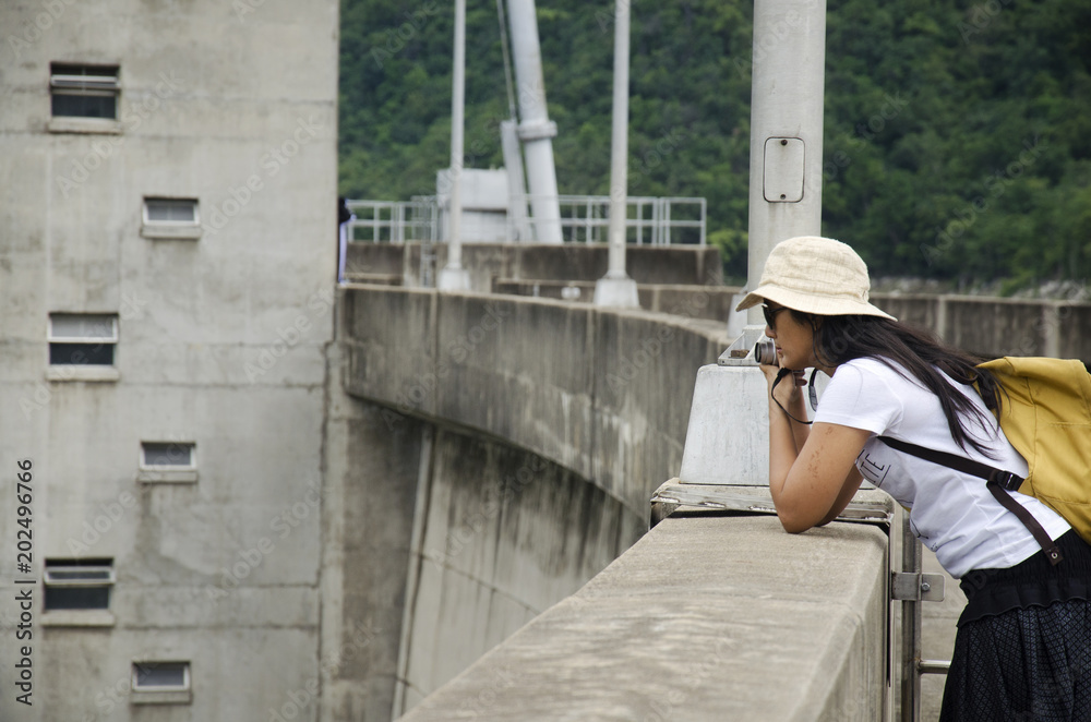 Asian thai women traveler visit at Bhumibol Dam in Tak, Thailand