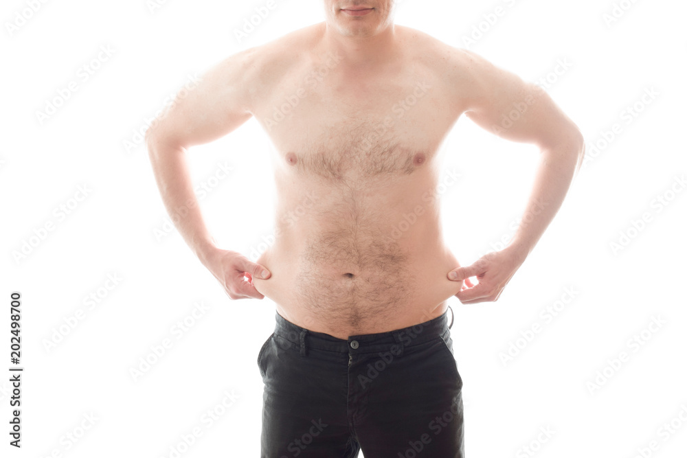 Excess weight, big belly, a man pulls himself by the side Excess weight, big belly, a man pulls himself by the side
