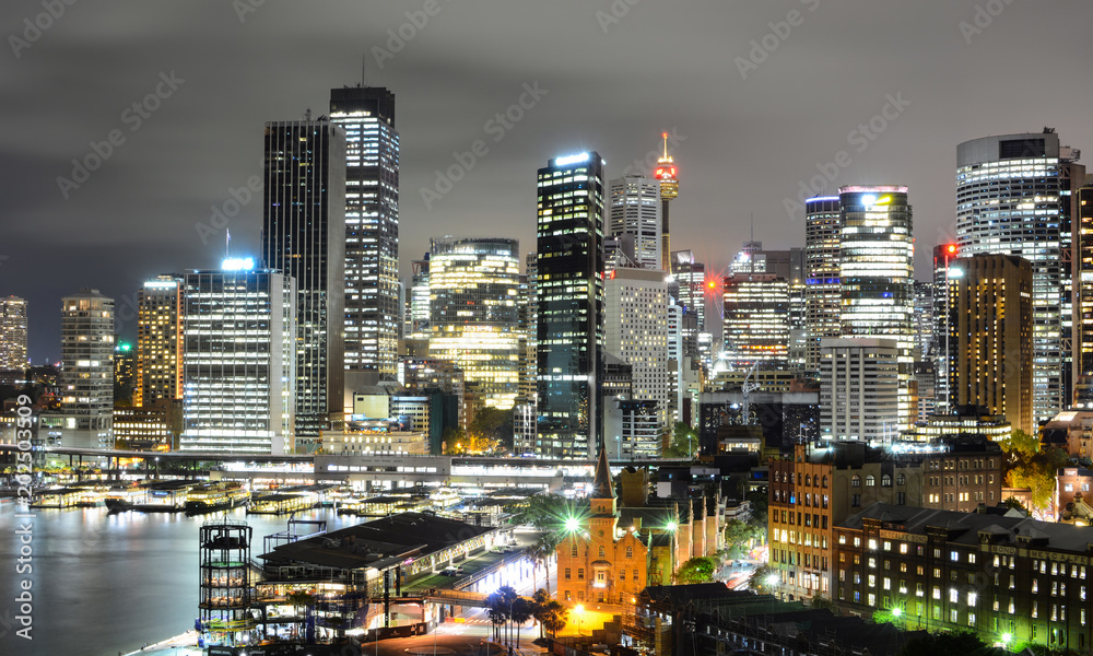 Dazzling night cityscape view of the Sydney central business district skyline and Circular Quay