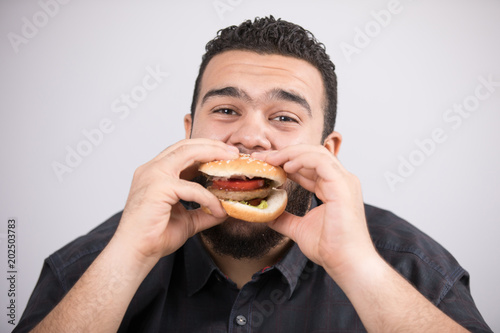 eating a burger sandwich