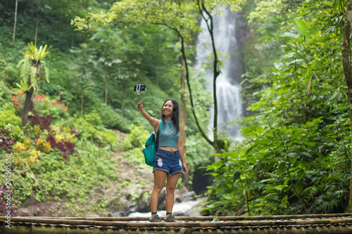 Tourist womantaking a selfie in Jungle