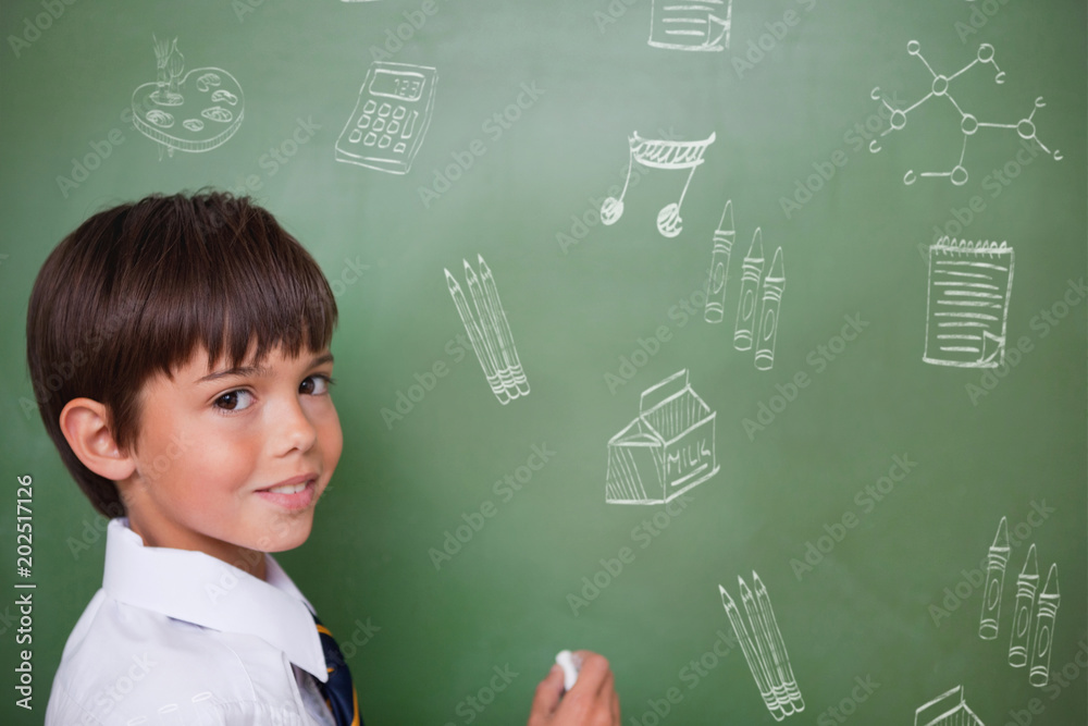 School doodles against cute pupil holding chalk
