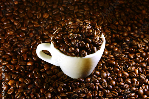 Coffee cup on a background of coffee beans
