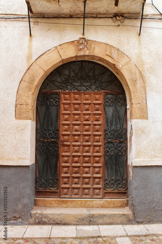 Old facade and entrance of majestic house in Alcaraz, Albacete province, Spain