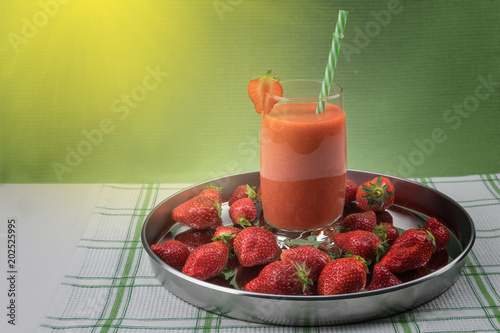 Strawberry juice with fresh ripe red berries
