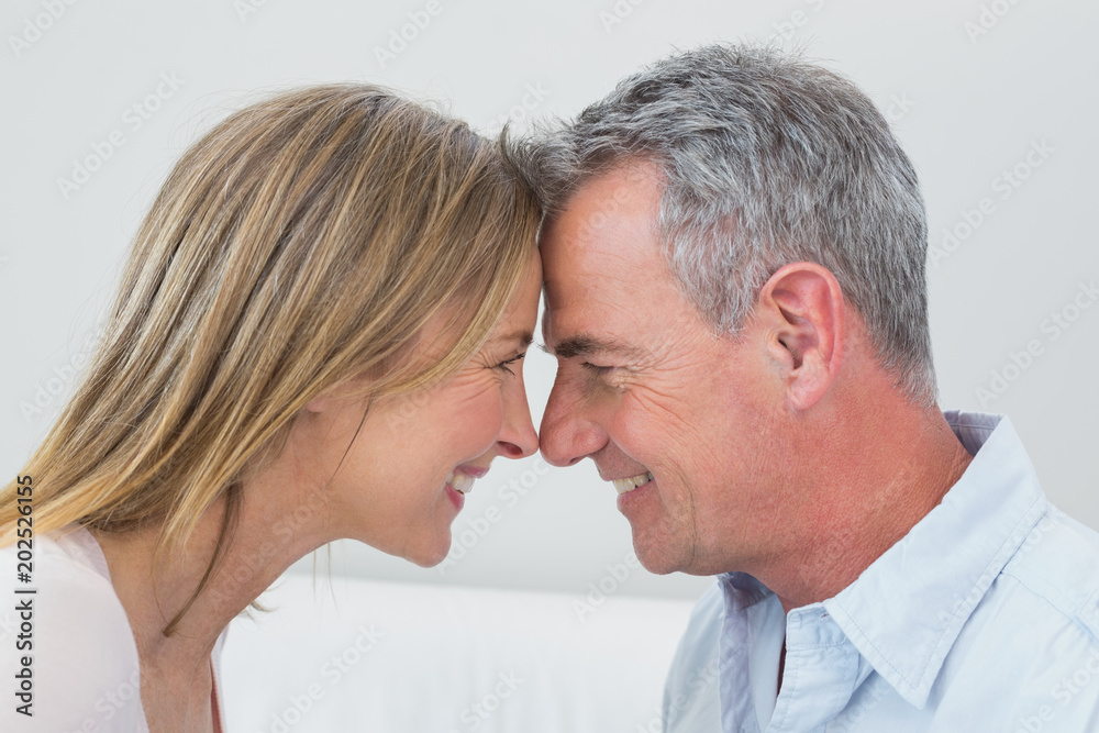 Side view of a happy couple looking at each other Side view of a happy couple looking at each other