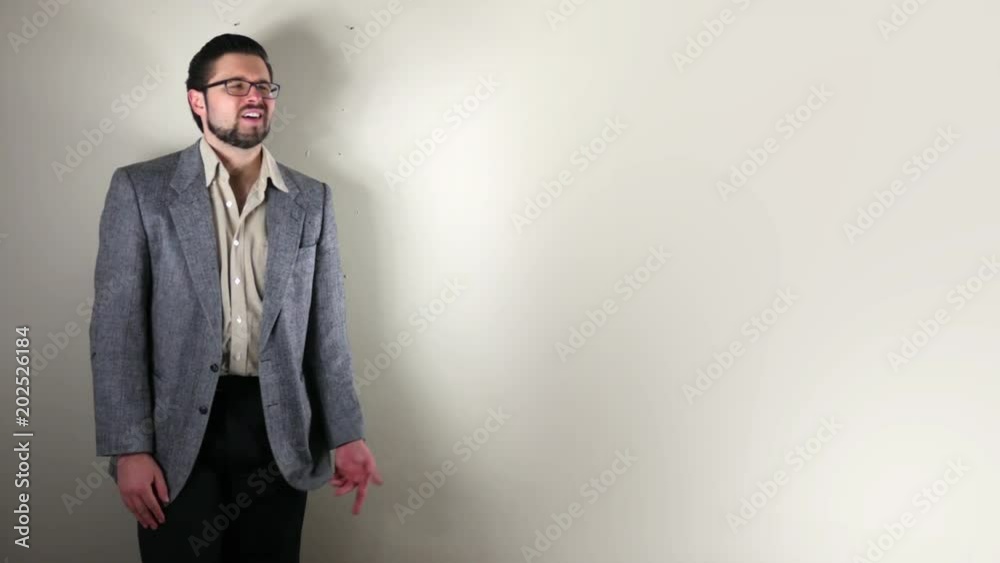 Unhappy corporate man points to off screen symbol ALT - put your own text or logo Unhappy corporate man points to off screen symbol ALT - put your own text or logo