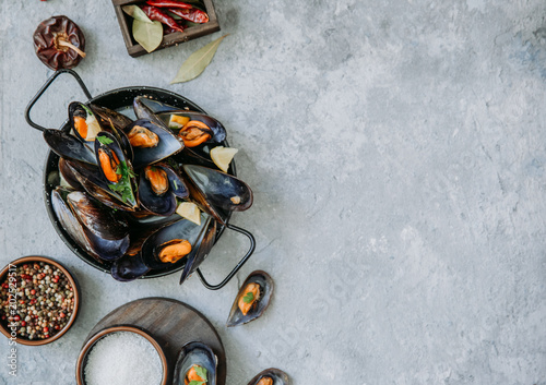  Mussels in wine with parsley and lemon. Seafood concept . Top view, flat lay, copy space photo