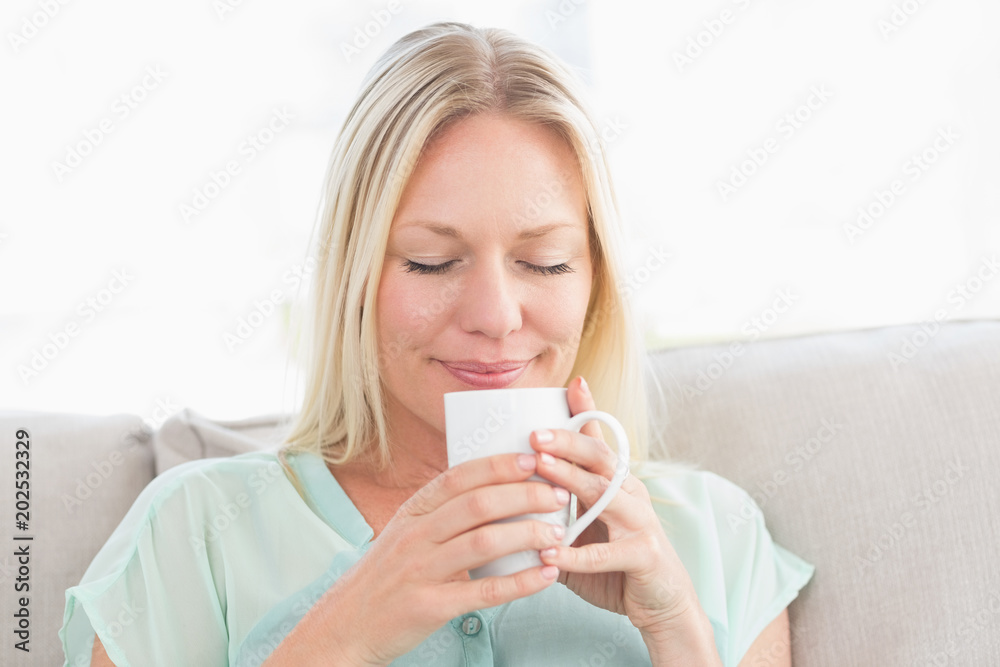 Woman enjoying coffee at home Woman enjoying coffee at home