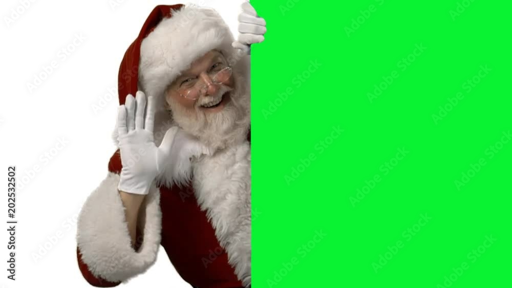 Santa waving from behind a green screen for your logo/text Stock Video ...