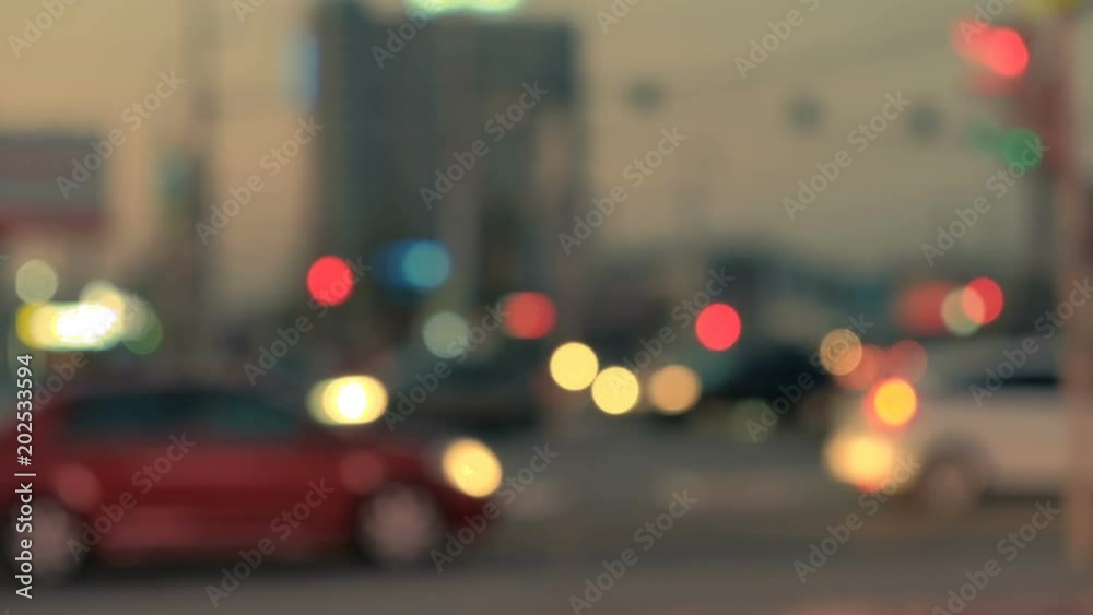 Driving at night blurred cars in city. Illuminated blurred city traffic on town streets. Driving at night blurred cars in city. Illuminated blurred city traffic on town streets.