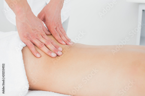 Fototapeta Naklejka Na Ścianę i Meble -  Closeup of a physiotherapist massaging womans back