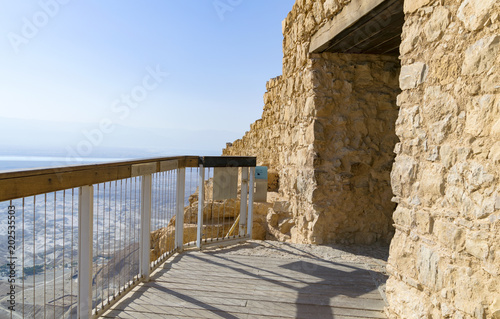 the main entrance to the Masada Fortress is also the entrance to  the famous snake path up the mountain with the Dead Sea in the background photo