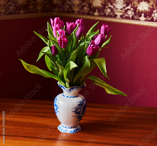 Lilac Tulips. Bud, petals, bouquet/Lilac tulips in a decorative vase stand on a table. Russia, Moscow, holiday, gift, mood, nature, flower, plant, bouquet, macro
