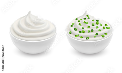 Vector realistic set of two ceramic bowls with white sour cream, yogurt, sauce tartar, soft cheese, mayonnaise with sliced green chives isolated on background. Natural condiment for eating and cooking