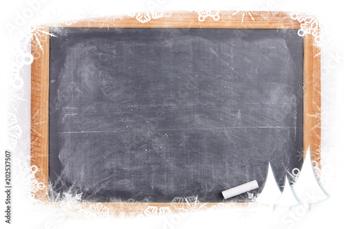 Composite image of frost frame against chalkboard with piece of chalk