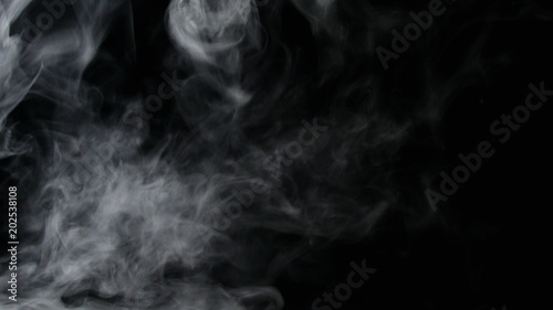 Isolated fog or smoke move on black color background photo