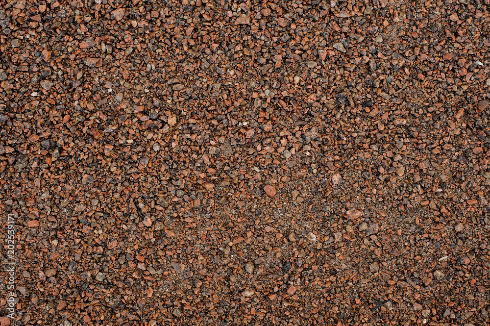 Texture background wallpaper of a large amount of pebbles stone in brown tones Texture background wallpaper of a large amount of pebbles stone in brown tones