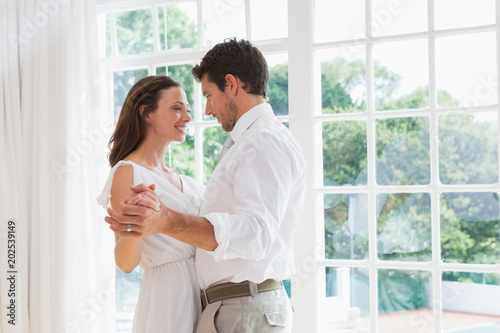 Loving young couple holding hands