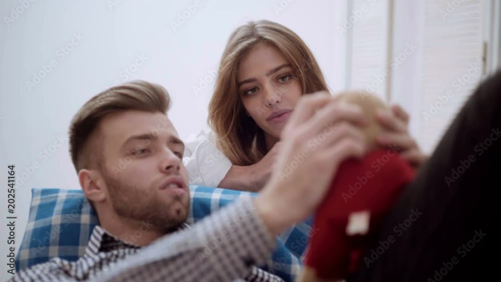 Love,happiness,people and fun concept. Beautiful couple relaxing. Young couple relaxing on sofa. Love,happiness,people and fun concept. Beautiful couple relaxing. Young couple relaxing on sofa.