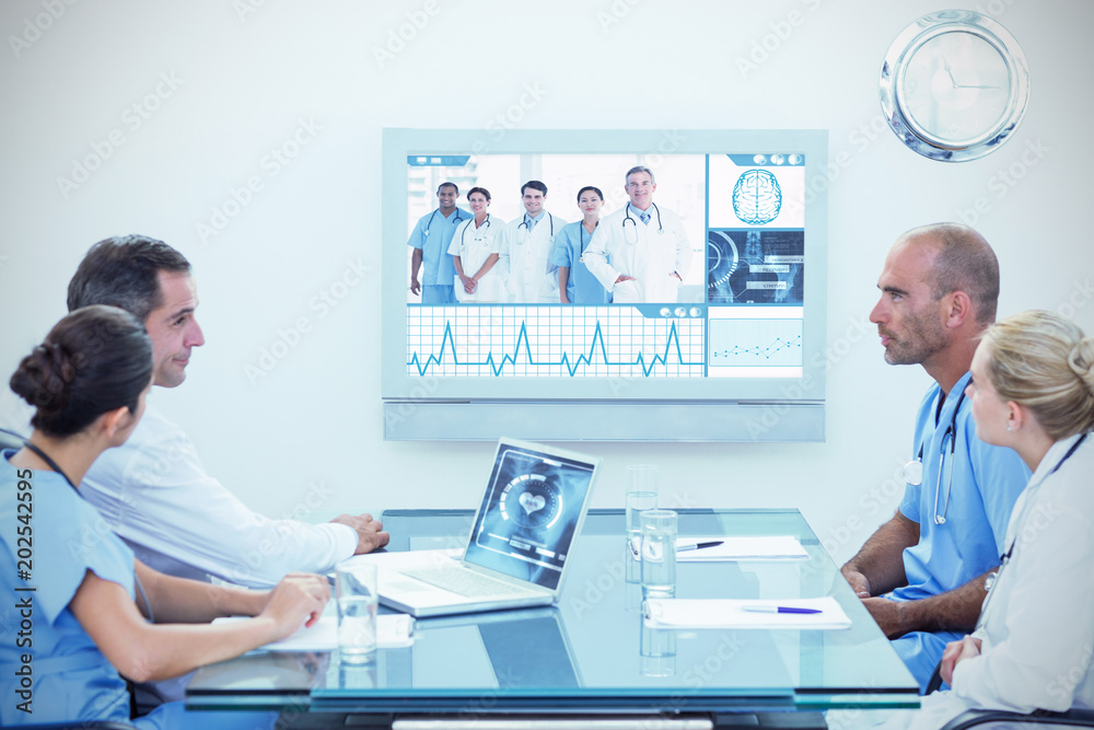 Φωτογραφία Team of doctors having a meeting against portrait of doctors in a row at hospita