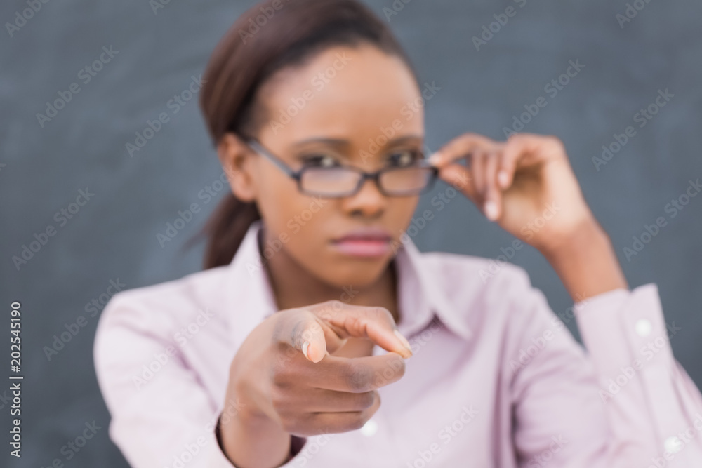 Focus on a strict black teacher pointing finger Focus on a strict black teacher pointing finger