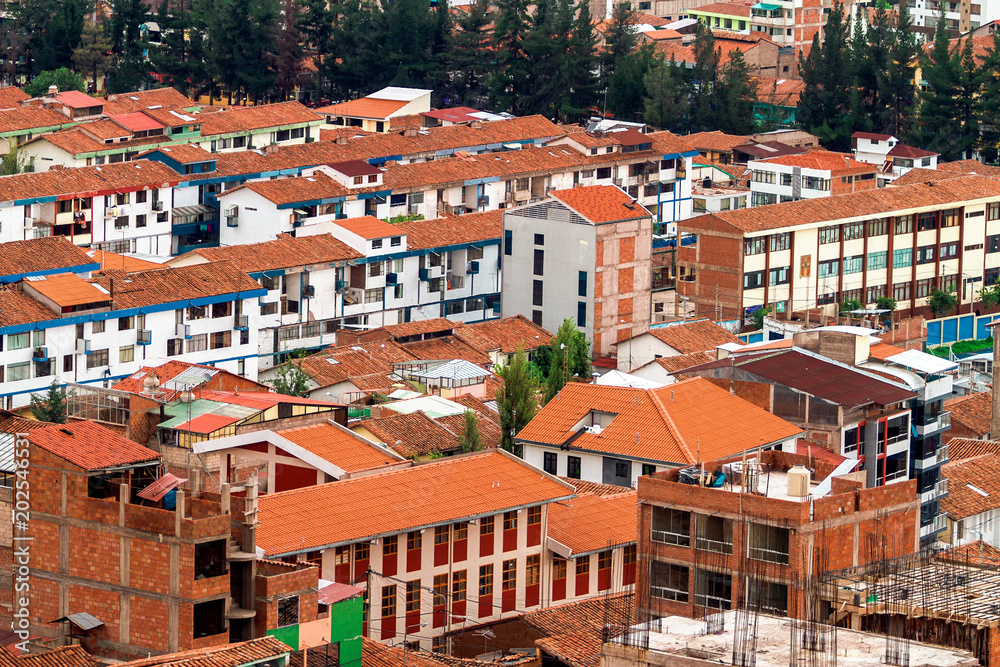 Aerial view of condominiums in Cusco (Peru) with roofs of red tiles