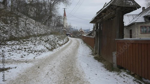 Road along houses in Oncesti  photo