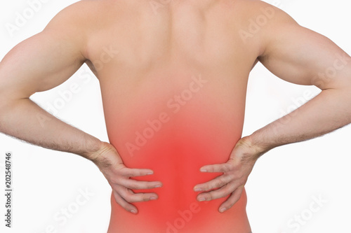 Rear view of muscular man with backache over white background