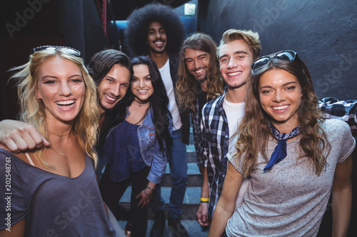 Portrait of happy friends in room