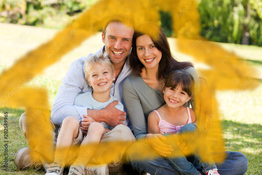 Fototapeta premium House outline in clouds against family sitting in the park
