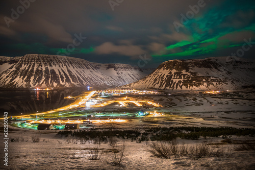 northern lights over mountains in iceland © lakkot