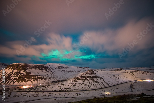 northern lights over mountains in iceland