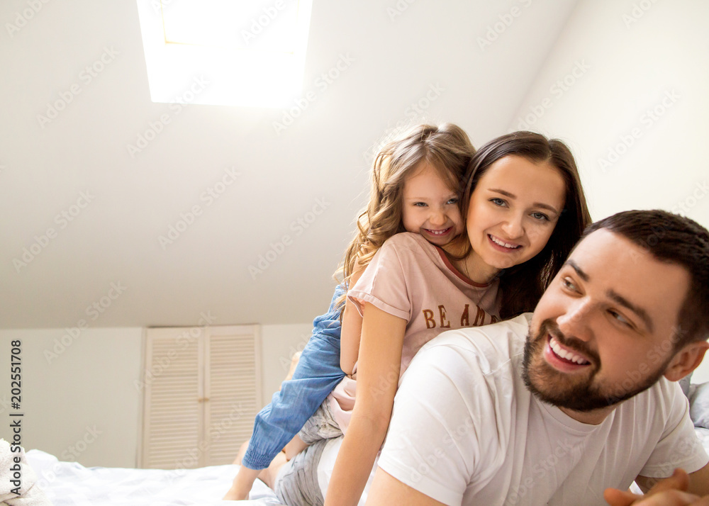 happy family at home in her room celebrating the fourth birthday of her daughter happy family at home in her room celebrating the fourth birthday of her daughter