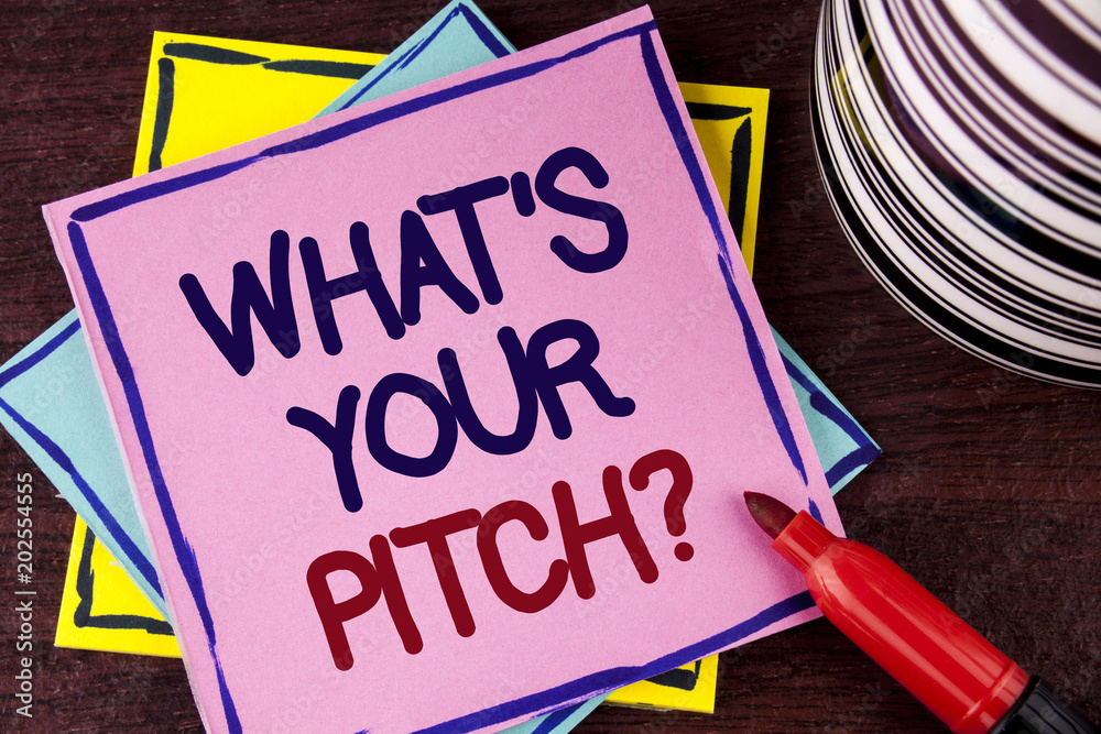 Word writing text What Is Your Pitch Question. Business concept for Present proposal Introducing Project or Product written on Pink Sticky Note paper on wooden background Cup and Marker next to it