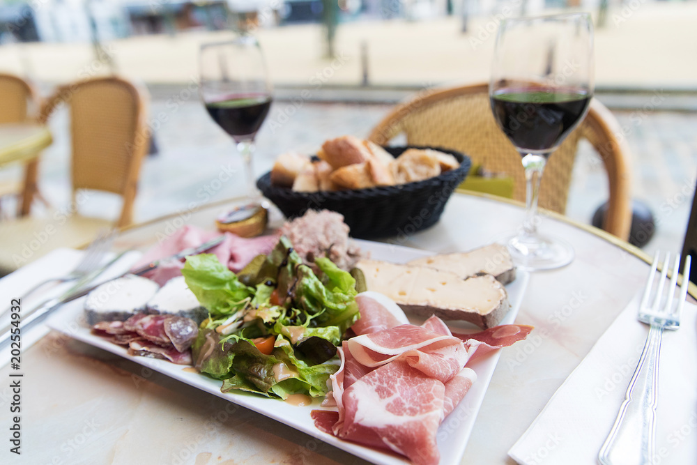 Meat and Cheese Platter with red wine at a French Cafe in Paris Meat and Cheese Platter with red wine at a French Cafe in Paris