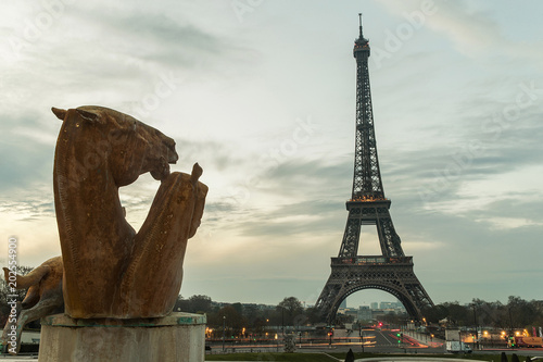 Horse statue at the Eiffel Tower during sunrise in Paris, France
