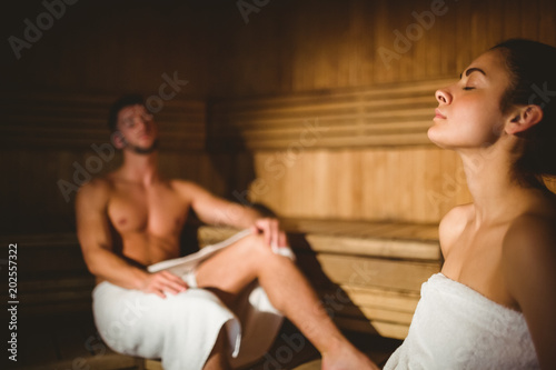Happy couple enjoying the sauna together photo