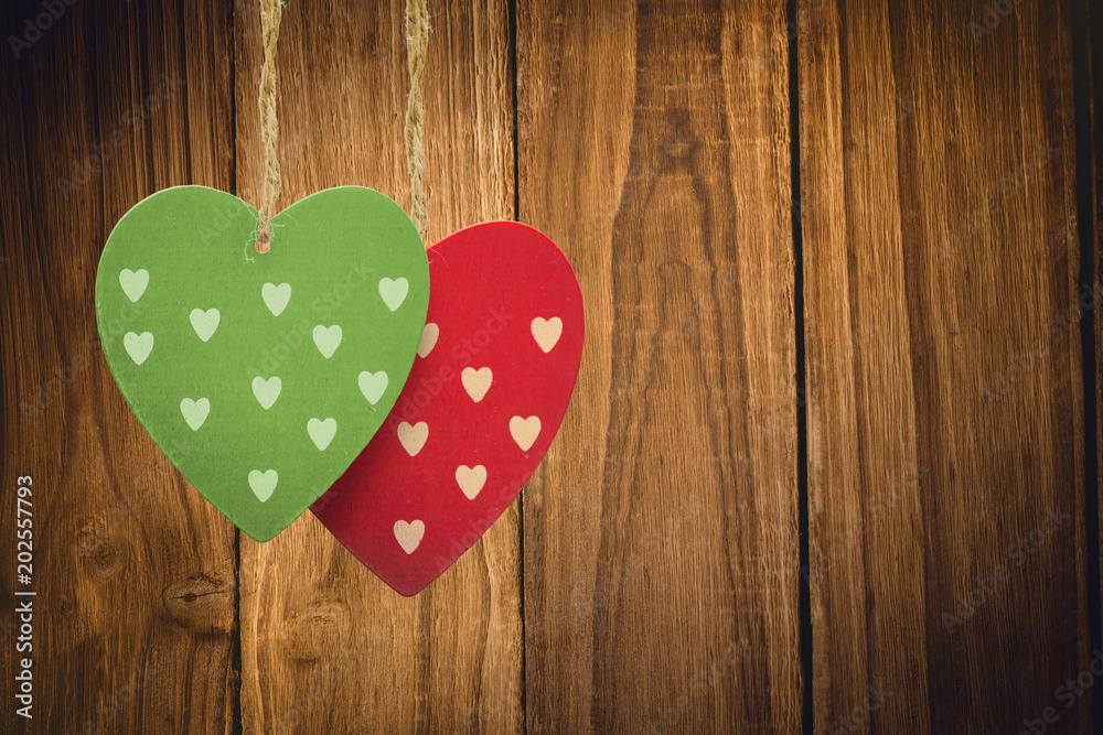 Cute heart decorations against wooden table Cute heart decorations against wooden table