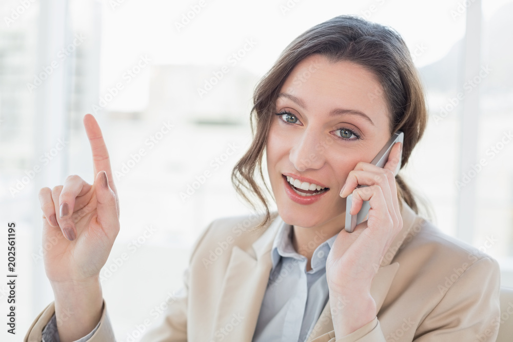 Smiling elegant businesswoman using mobile phone Smiling elegant businesswoman using mobile phone