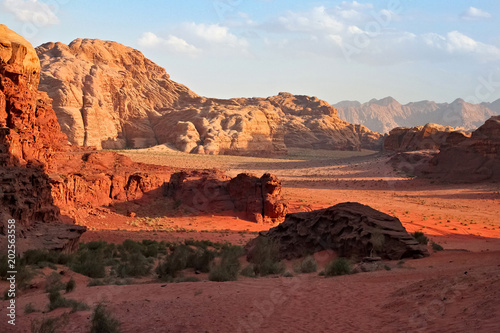 Red mountains of the canyon of Wadi Rum desert in Jordan. Wadi Rum also known as The Valley of the Moon is a valley cut into the sandstone and granite rock in southern Jordan to the east of Aqaba. © Renar
