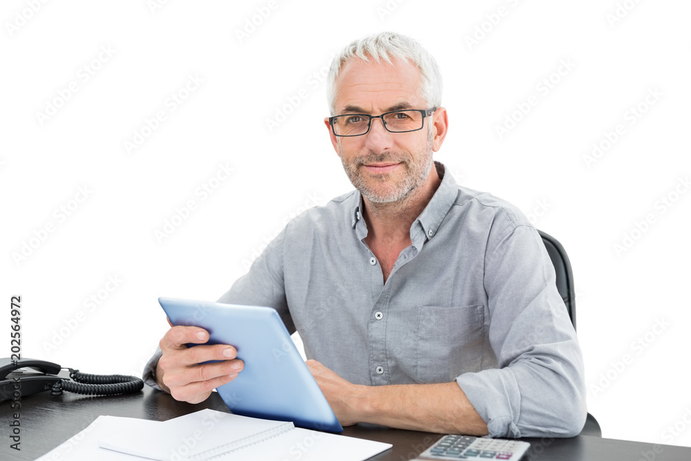 Portrait of a mature businessman with digital tablet and telephone Portrait of a mature businessman with digital tablet and telephone