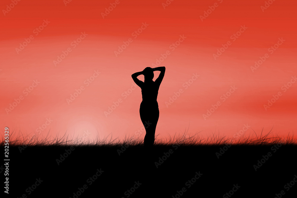 Fit brunette smiling at camera against red sky over grass