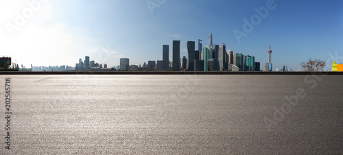 Empty road surface floor with city landmark buildings of panorama