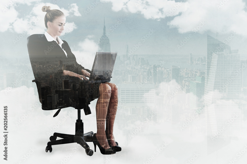 Businesswoman sitting on swivel chair with laptop against new york Businesswoman sitting on swivel chair with laptop against new york