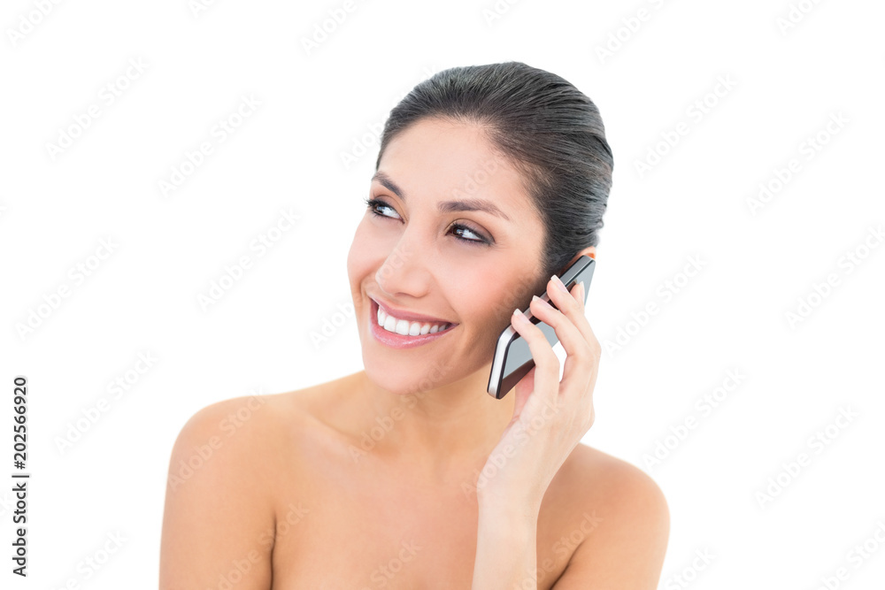 Happy brunette making a call on smartphone Happy brunette making a call on smartphone